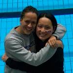 Islander teammates Alex Seidel and Sabrina Kwan pose in front of the pool where they competed in the NCAA D3 National Swimming and Dive Championships.