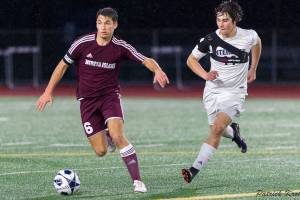 Photo courtesy of Patrick Krohn/Patrick Krohn Photography                                Mercer Island Islanders defender Reis Kissel, left, dribbles the ball upfield while being guarded by Interlake Saints midfielder Andre Garone, right, in a matchup between KingCo 3A teams on April 11 at Interlake High School in Bellevue. Mercer Island defeated Interlake 2-1 in the contest.