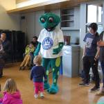 Leap, the mascot of Mercer Islands sustainability fair, greets young residents at the event on April 14. Katie Metzger/staff photo