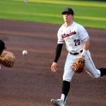 Andy Nystrom, staff photo                                Mercer Island infielder Cole Miller, right, tosses the ball to first baseman Justin Ho for an out in the top of the second inning against the Redmond Mustangs in a KingCo 3A playoff baseball game on May 3 at Bannerwood Park in Bellevue. Mercer Island, which trailed by four runs early in the game, earned a 7-6 comeback win.