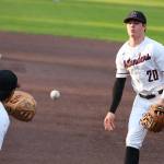 Andy Nystrom, staff photo                                Mercer Island infielder Cole Miller, right, tosses the ball to first baseman Justin Ho for an out in the top of the second inning against the Redmond Mustangs in a KingCo 3A playoff baseball game on May 3 at Bannerwood Park in Bellevue. Mercer Island, which trailed by four runs early in the game, earned a 7-6 comeback win.