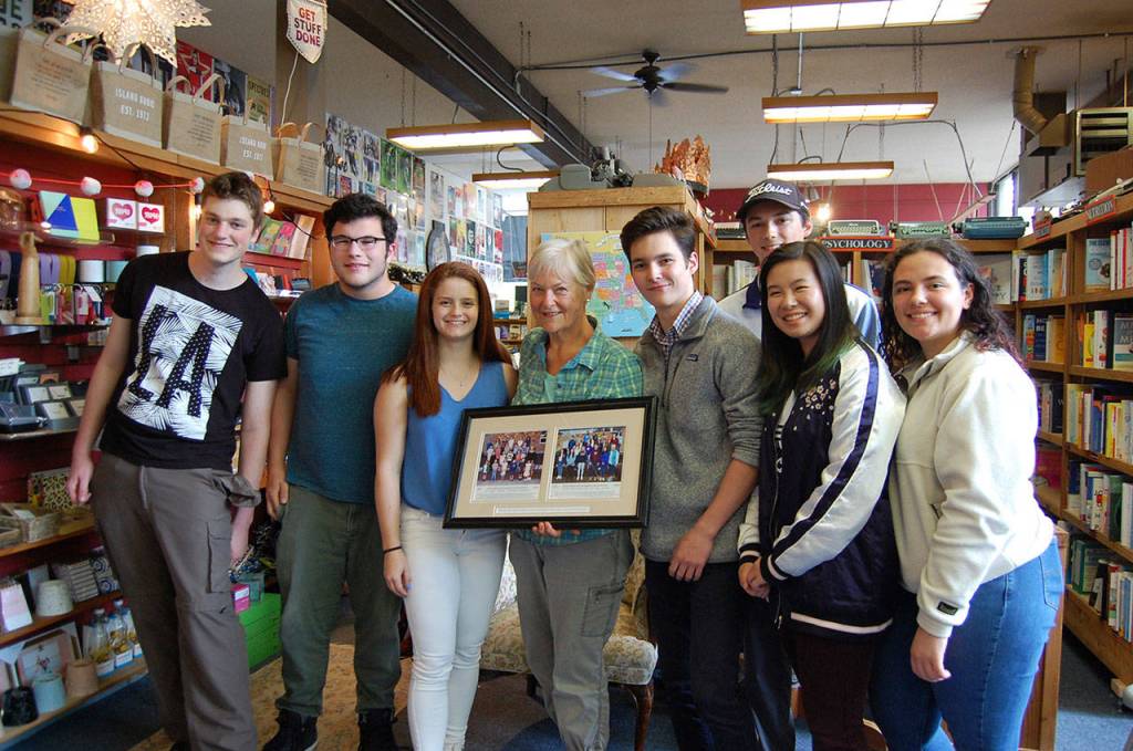 Marilyn ONeill poses with some of her former kindergarten students, who are graduating from high school in June. Katie Metzger/staff photo