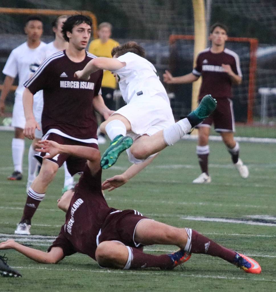 Mercer Island and Redmond players collide. Andy Nystrom / staff photo