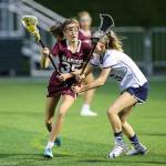 Photo courtesy of Rick Edelman/Rick Edelman Photography                                Mercer Islands Hannah Tiscornia, left, tries to maneuver around a Bainbridge Island player on May 18 at Starfire Sports Complex in Tukwila.