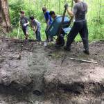 Scouts from Troop 457 dig ditches to enhance the drainage above Mercerdale Park as part of Mark Manginos Eagle Project.