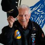 At the conclusion of his talk, 95-year-old Dick Nelms, who flew 35 missions in B-17 bombers in World War II, tips his cap to appreciative fellow military pilots at the Stanwood Eagles Thursday. (Dan Bates / The Herald)