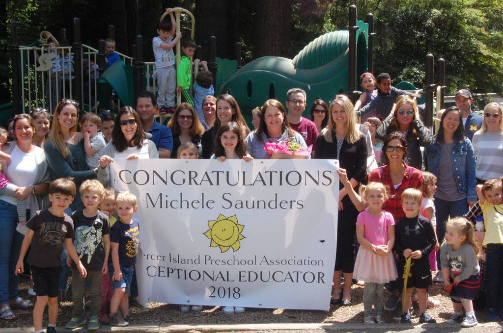Exceptional Educator Michele Saunders smiles with current and former students and parents at Sunnybeam School on May 30. Katie Metzger/staff photo