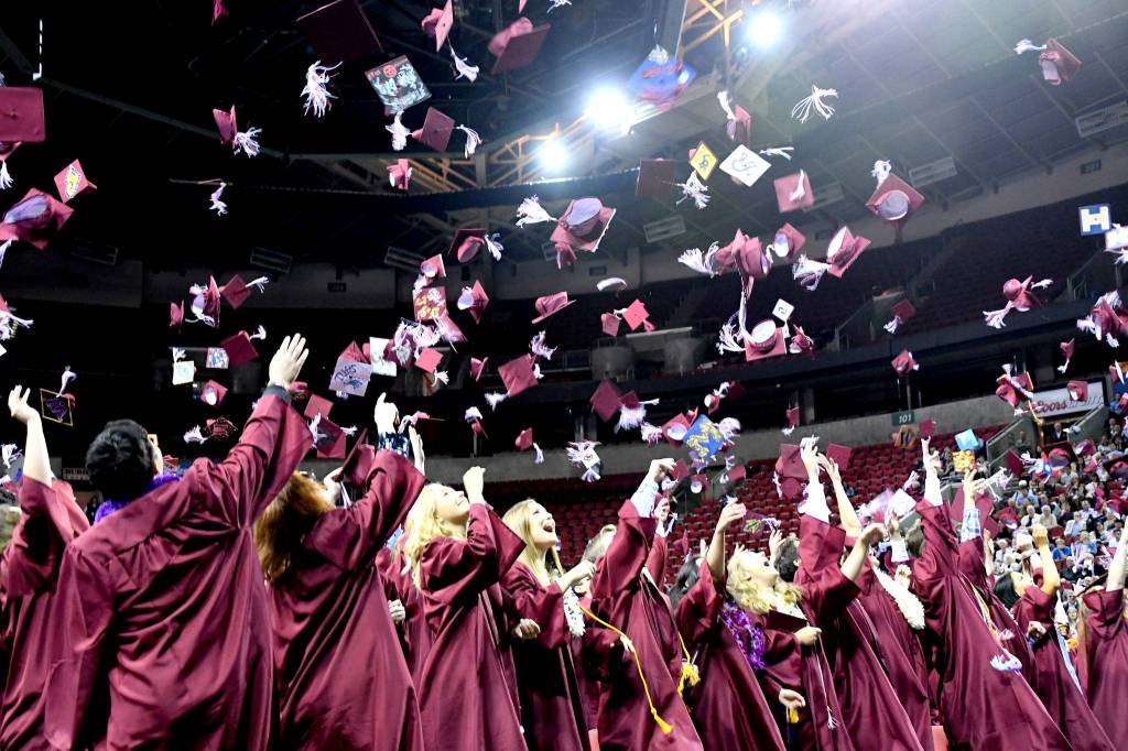 Mercer Island High School seniors throw their graduation caps in the air during the schools commencement on June 7 at KeyArena in Seattle. For more photos, please see page 18. Photo courtesy of Allison Nelson