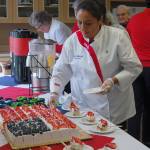 After the Flag Day celebration, Covenant Shores residents and guests enjoy an American flag cake. Katie Metzger/staff photo