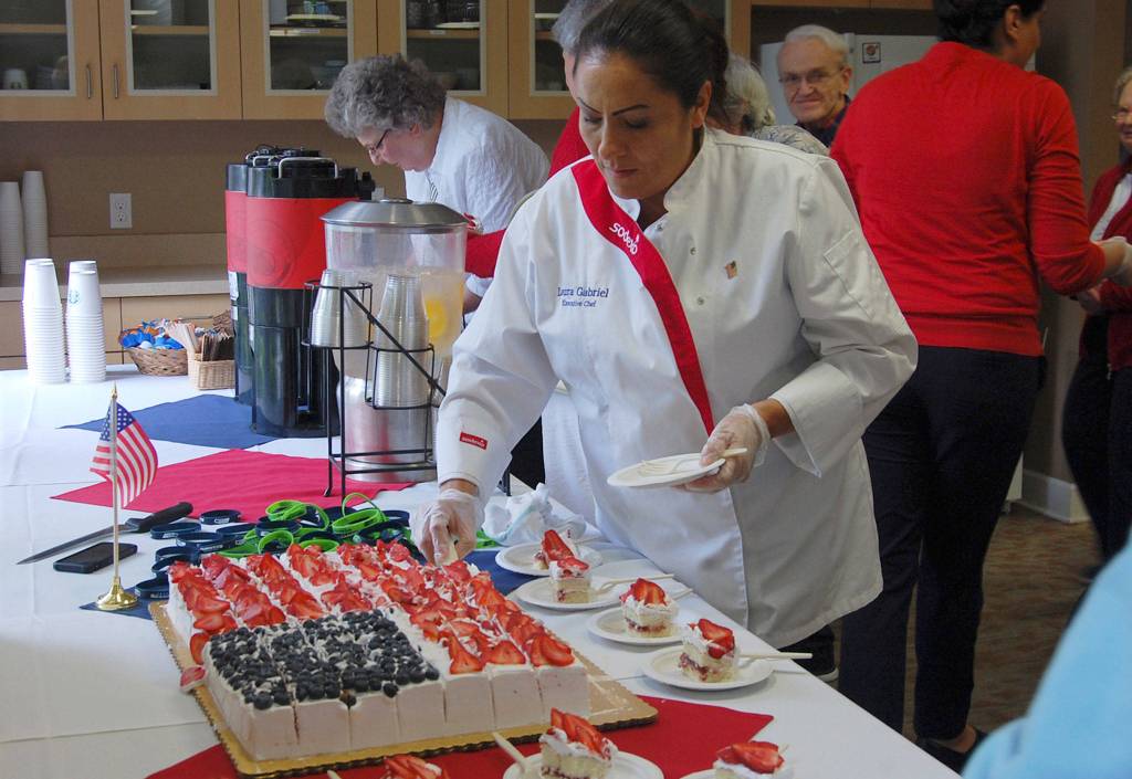 After the Flag Day celebration, Covenant Shores residents and guests enjoy an American flag cake. Katie Metzger/staff photo