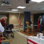 Attendees say the Pledge of Allegiance at the Flag Day ceremony at Covenant Shores on June 14. Katie Metzger/staff photo