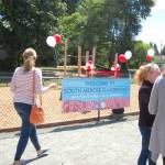 Community members celebrate the grand opening of a new natural-style playground on the south end of Mercer Island. Katie Metzger/staff photo