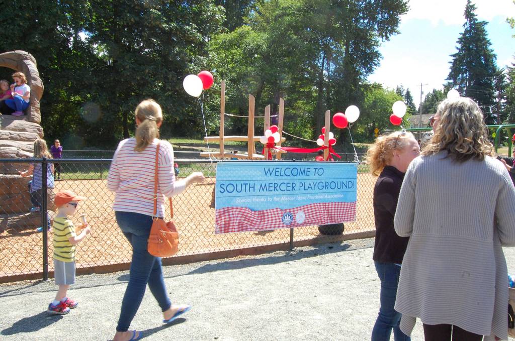 Community members celebrate the grand opening of a new natural-style playground on the south end of Mercer Island. Katie Metzger/staff photo