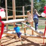 Kids climb the new playground at Mercer Islands South Mercer Playfields. Katie Metzger/staff photo