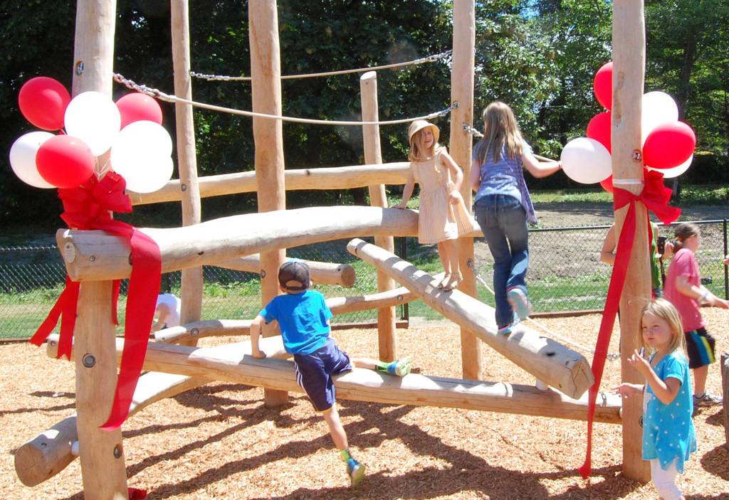 Kids climb the new playground at Mercer Islands South Mercer Playfields. Katie Metzger/staff photo
