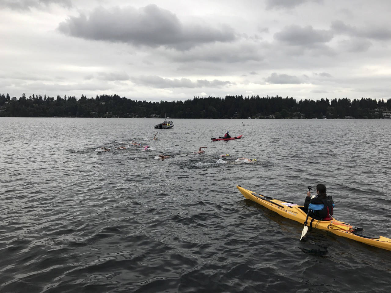 Avid swimmers spanning six states partook in the Mercer Island marathon swim on June 8. The distance, which covered 20 kilometers, saw 10 competitors complete the swim around Mercer Island in Lake Washington.                                Participants included Daniela Klaz (Maine), Marcy MacDonald (Connecticut), Chris Greene (Georgia), Cindy Werhane (Oregon), Rijl Barber (Oregon), Wendy Van De Sompele (Washington), Jessi Harewicz (Washington), Suzie Dods (California) and Kim Rutherford (California). Klaz finished in first place with a time of 6:15.28.The swimmers (pictured) began their journey near the fishing dock at Luther Burbank Park at 8 a.m. on June 8 as they headed toward the east channel bridge. Photo courtesy of Liz Rosen