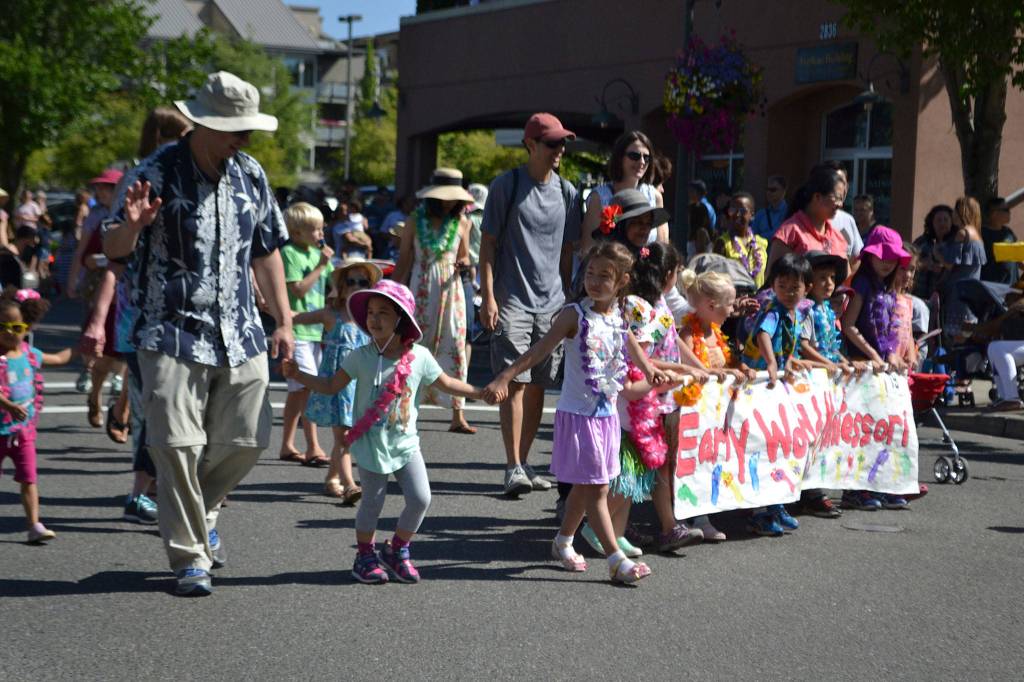 Early World Montessori students walk in the Summer Celebration parade. Katie Metzger/staff photo