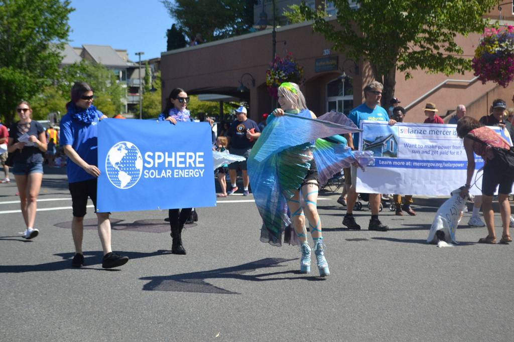 Summer Celebration parade participants encourage Islanders to try solar energy. Katie Metzger/staff photo