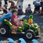 Representing the Island Vibes theme and Pixie Hill Preschool, a young Islander rides in the Summer Celebration parade. Katie Metzger/staff photo