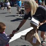 Island Books owner Laurie Raisys hands out books and other treats at the Summer Celebration parade in downtown Mercer Island. Katie Metzger/staff photo