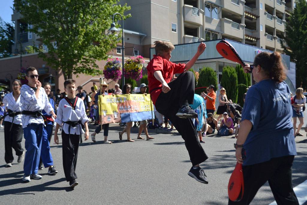 Students from Mercer Island Martial Arts show off their skills in the Summer Celebration parade. Katie Metzger/staff photo