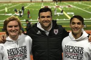 Photo courtesy of Tim Bauman                                Mercer Island boys soccer players Reis Kissel and Hunter Bauman were named to the Washington High School first-team all-state boys soccer this past May.                                It was the third consecutive season Kissel and Bauman received first-team, all-state honors. Reis, who played defender for the Islanders, will be attending Vassar College this fall. Bauman, who played midfielder for the Islanders, will be attending the University of Washington. Bauman (left), Islanders head coach Colin Rigby (center) and Kissel (right) are pictured in the above photo.