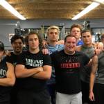Sound Publishing sportswriter Shaun Scott poses for a quick picture with members of the Bellevue Christian Vikings football team following a weight training session on July 19 at Bellevue Christian School in Bellevue.                                Photo courtesy of Todd Green