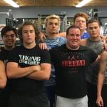 Sound Publishing sportswriter Shaun Scott poses for a quick picture with members of the Bellevue Christian Vikings football team following a weight training session on July 19 at Bellevue Christian School in Bellevue.                                Photo courtesy of Todd Green