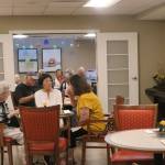Friends chat in one of Island Houses dining rooms. Katie Metzger/staff photo