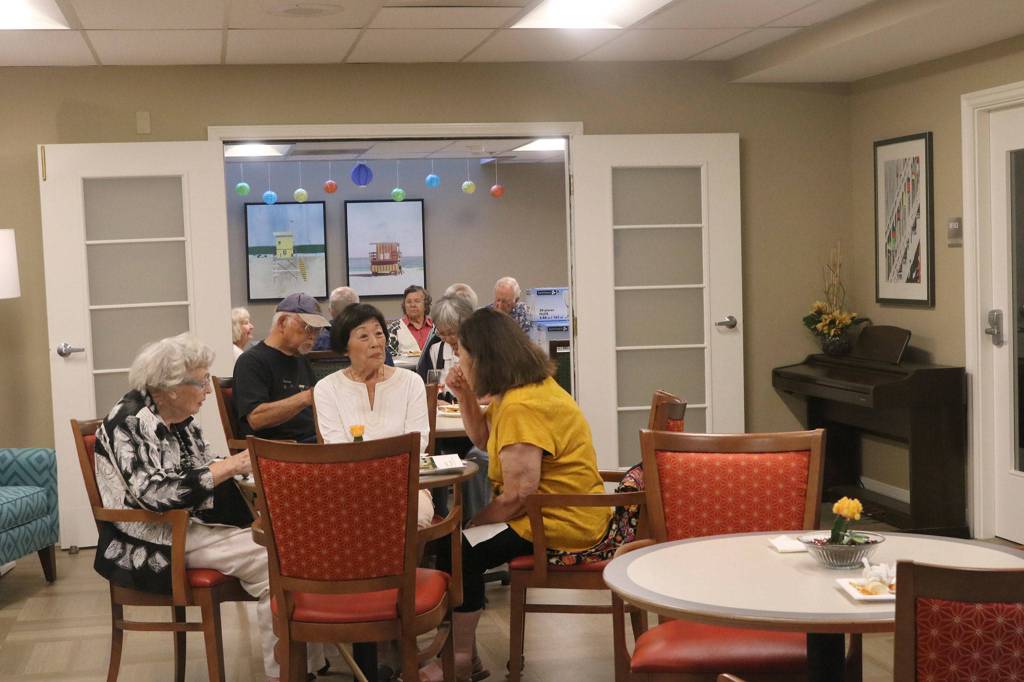 Friends chat in one of Island Houses dining rooms. Katie Metzger/staff photo