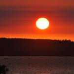 The smoky air makes for colorful sunsets, such as this one over Possession Sound on Monday evening. Sue Misao/Sound Publishing