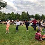 Islanders dance at a previous Mostly Music performance. While other concerts in the annual summer series have taken place on Thursday evenings, the last one will be on Friday, and will feature a Journey cover band, food truck rodeo and Womens Equality Day celebration. Photo courtesy of the city of Mercer Island