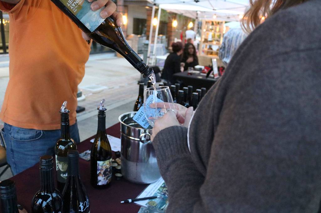 Art Uncorked patrons try samples of local wines. Katie Metzger/staff photo