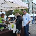 Ralph Swanson, board president of the Mercer Island Chamber of Commerce, enjoys some Island Treats at Art Uncorked. Katie Metzger/staff photo