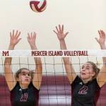 Mercer Island volleyball players Anika Iverson, left, and Quinn Casey, right, leap into the air against the Skyline Spartans in a non-league contest on Sept. 12 on Mercer Island. Skyline defeated Mercer Island 3-1 in the matchup. Photo courtesy of Patrick Krohn/Patrick Krohn Photography