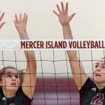Mercer Island volleyball players Anika Iverson, left, and Quinn Casey, right, leap into the air against the Skyline Spartans in a non-league contest on Sept. 12 on Mercer Island. Skyline defeated Mercer Island 3-1 in the matchup. Photo courtesy of Patrick Krohn/Patrick Krohn Photography