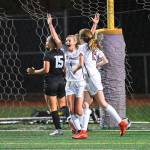 Mercer Island senior captain Jackie Stenberg, left, celebrates scoring in regular time while senior Jackie Gilroy joins her during the Islanders 2-1 overtime girls soccer victory over Lake Washington on Sept. 20. Courtesy of Dale Garvey