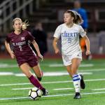 Mercer Island senior midfielder Emily Arron, left, puts pressure on Liberty defender Cameron Nelson, right, in a matchup featuring two of the top soccer programs in the 3A/2A KingCo Division. Mercer Island earned a 2-1 comeback victory on Sept. 25 on Mercer Island. Photo courtesy of Patrick Krohn/Patrick Krohn Photography