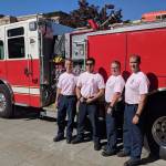 (From left) Mercer Island firefighters Lt. Ray Austin, Dan Jackson, Alec Munro and Lt. Steve McCoy pose for a picture in their pastel pink breast cancer awareness shirts. Photo courtesy of Ray Austin