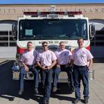 (From left) Mercer Island firefighters Lt. Ray Austin, Dan Jackson, Alec Munro and Lt. Steve McCoy pose for a picture in their pastel pink breast cancer awareness shirts. Photo courtesy of Ray Austin
