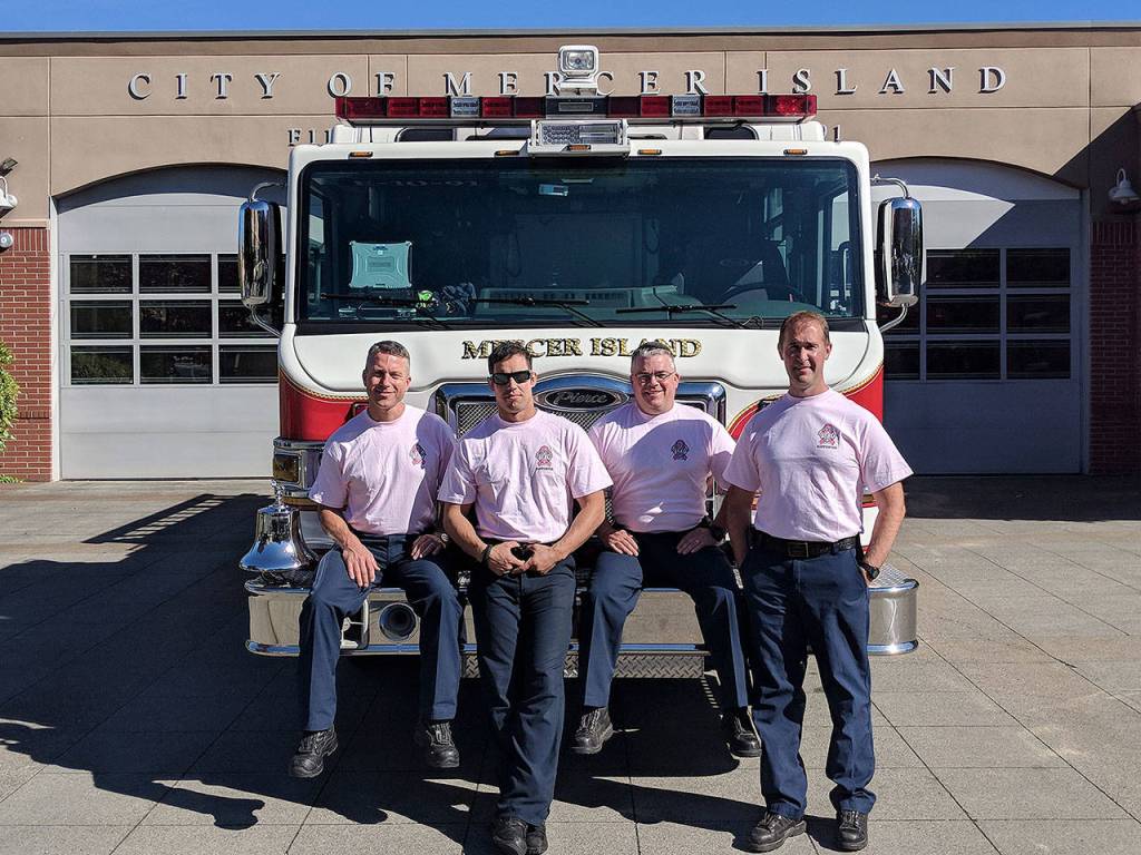 (From left) Mercer Island firefighters Lt. Ray Austin, Dan Jackson, Alec Munro and Lt. Steve McCoy pose for a picture in their pastel pink breast cancer awareness shirts. Photo courtesy of Ray Austin