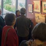 A group reviews the awards at the 2017 MIVAL Holiday Show at Mercer Island Community and Event Center. Photo courtesy of Mary Pat Mansfield
