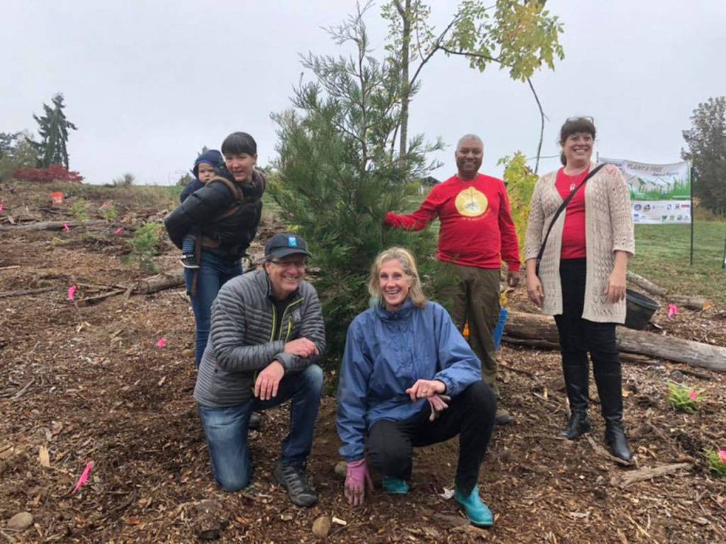 More than 200 volunteers came to the city of Mercer Islands first Arbor Day event on Oct. 20 to celebrate its Tree City USA designation, including Mayor Debbie Bertlin and King County Councilmember Claudia Balducci. Photo courtesy of Julie Underwood