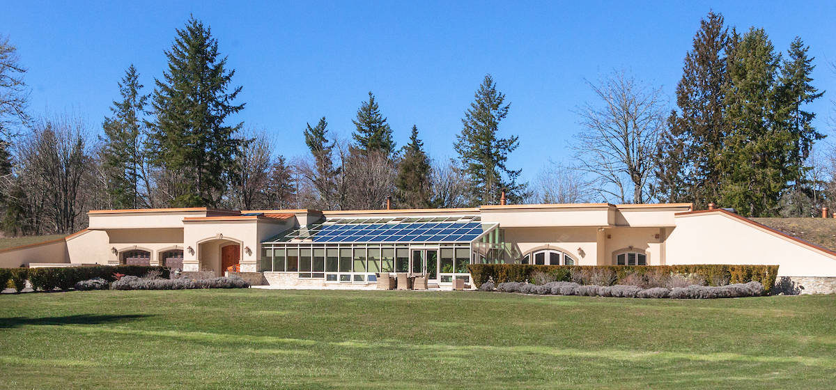 The main home on this magnificent 40-acre estate in Yelm is built into a natural hillside and boasts a luxurious open concept design throughout, plus secure, self-sustainable underground living quarters off the kitchen.