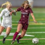 Mercer Island senior midfielder Jackie Stenberg, right, tries to keep the ball away from Bonney Lake midfielder Summer Kober, left, in the first round of the Class 3A state playoffs on Nov. 6 at Mercer Island High School. Photo courtesy of Patrick Krohn/Patrick Krohn Photography