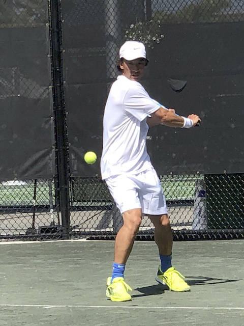 Mercer Island Islanders boys tennis head coach Ryan Pang (pictured) practices before a doubles match at the International Tennis Federation Seniors World Team Championships in Miami. Photo courtesy of Ryan Pang