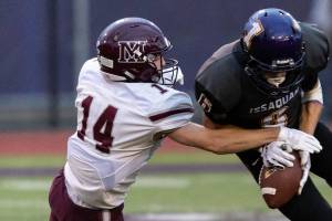 Mercer Island football player Hunter Johnson, left, makes a play against the Issaquah Eagles during a non-league game this past September. Johnson was one of three Islanders football players that captured 2A/3A KingCo first-team, all-league honors. Photo courtesy of Patrick Krohn/Patrick Krohn Photography