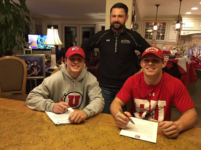 Mercer Island Islanders seniors Stew Vassau, left, and Donnie Howard, right, signed their letters of committment on Nov. 19 to continue their lacrosse careers at the collegiate level. Vassau will play lacrosse for the University of Utah and Howard will continue his lacrosse career at Boston University. Mercer Island boys lacrosse head coach Ian OHearn, center, is pictured with his two collegiate bound players. Photo courtesy of Don Howard