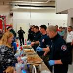 (Closest to farthest) Mercer Island Firefighters Curt Groscost, Shane Gruger, Joe White, Andrew Pearson serve homemade chili to locals attending the 2017 Firehouse Munch. Photo courtesy of the city of Mercer Island