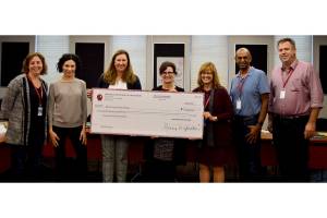 From left, Mercer Island School Board director Deborah Lurie, Mercer Island Schools Foundation (MISF) board member Tema Burkey, MISF development director Tammy Shoop, School Board president Tracy Drinkwater, Superintendent Donna Colosky, school board director David DSouza and school board vice president Ralph Jorgenson pose for a photo after MISF presented a $600,000 check to the school board. Photo courtesy of Mercer Island School District
